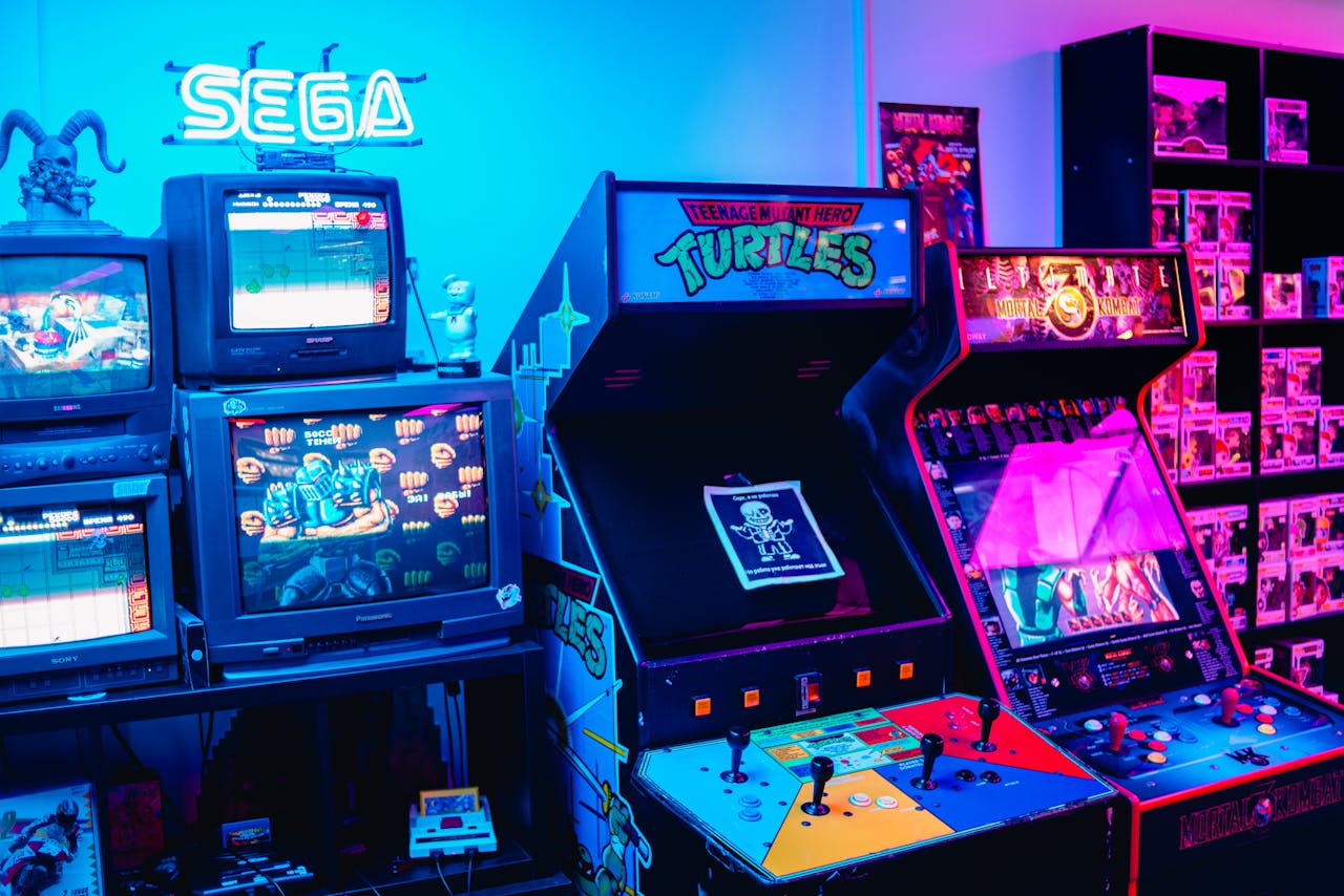 cta-02 A vibrant retro arcade room featuring classic gaming machines and colorful neon lighting.